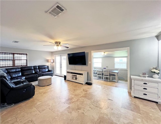 6021 Amhurst St, Metairie, LA 70003 - living area featuring ceiling fan and light stone finish floors