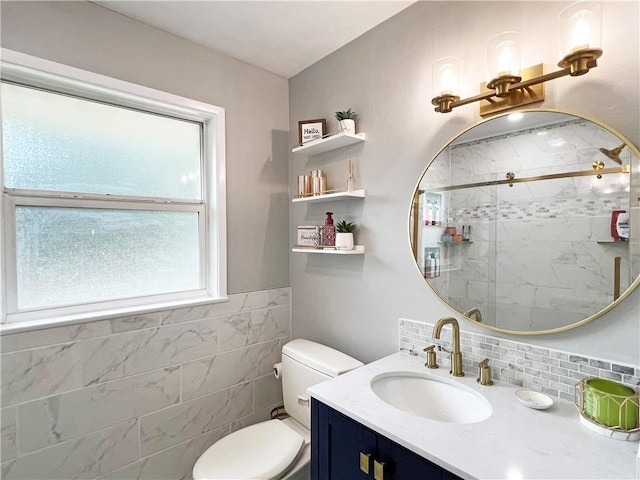 6021 Amhurst St, Metairie, LA 70003 - full bath with vanity, toilet, a tile shower, and tile walls