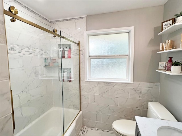 6021 Amhurst St, Metairie, LA 70003 - full bath with toilet, vanity, enclosed tub / shower combo, and tile walls