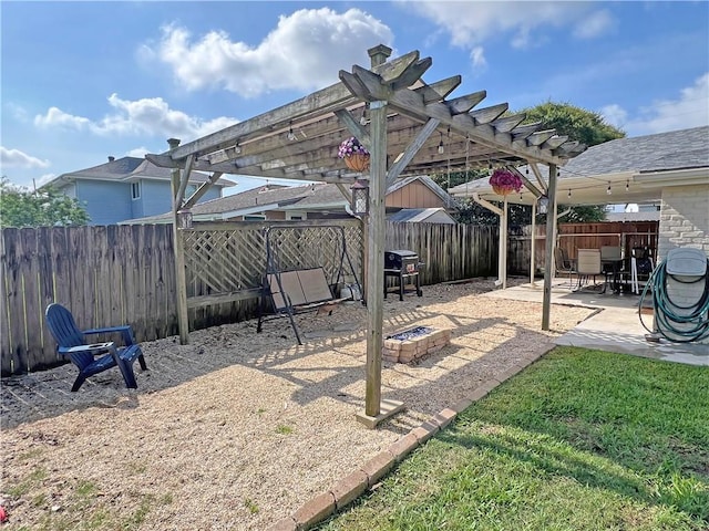 6021 Amhurst St, Metairie, LA 70003 - fenced backyard with a pergola, a patio area, and a fire pit