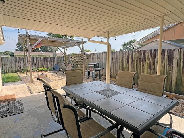 6021 Amhurst St, Metairie, LA 70003 - fenced backyard featuring outdoor dining area, a patio, and area for grilling