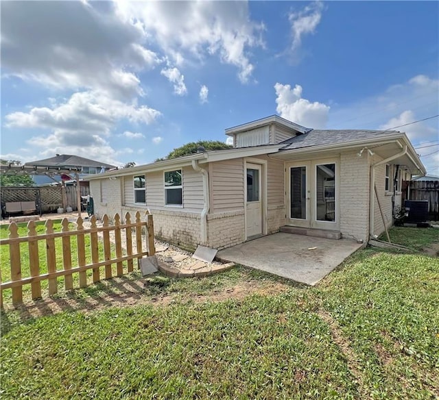 6021 Amhurst St, Metairie, LA 70003 - back of house featuring brick siding, french doors, and a patio