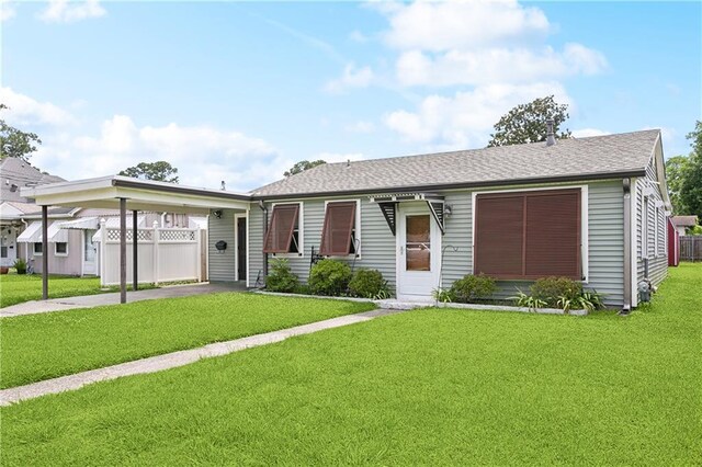 929 Franklin Ave, Jefferson, LA 70123 - ranch-style home with an attached carport and a shingled roof