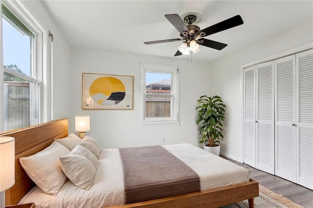 929 Franklin Ave, Jefferson, LA 70123 - bedroom featuring a closet, wood finished floors, ceiling fan, and baseboards