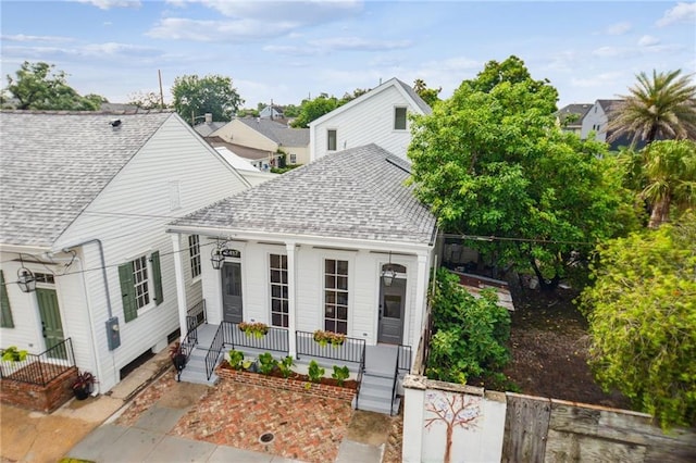 2417 Rousseau St, New Orleans, LA 70130 - view of front of property featuring roof with shingles and covered porch