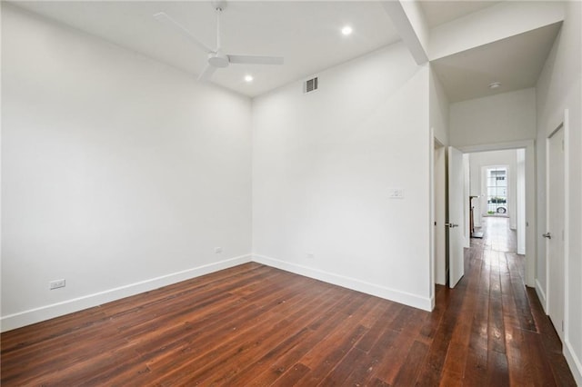 2417 Rousseau St, New Orleans, LA 70130 - spare room featuring dark wood-type flooring, baseboards, ceiling fan, and recessed lighting