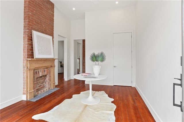 2417 Rousseau St, New Orleans, LA 70130 - entryway featuring baseboards, wood-type flooring, a fireplace, and recessed lighting