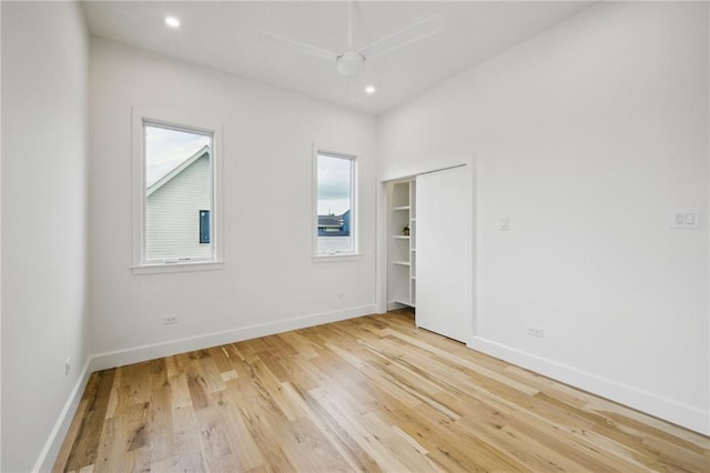 2417 Rousseau St, New Orleans, LA 70130 - unfurnished bedroom featuring light wood-style flooring, baseboards, and recessed lighting