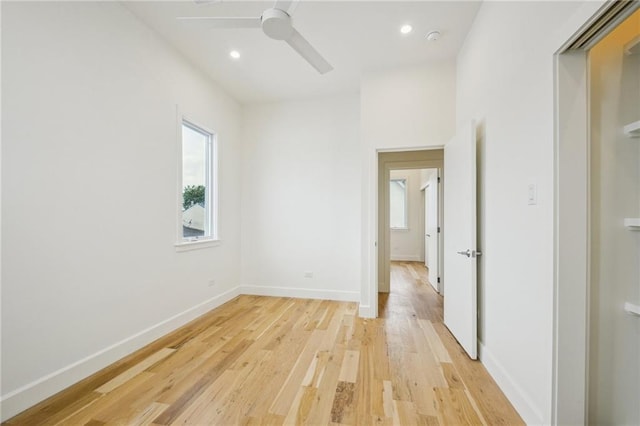 2417 Rousseau St, New Orleans, LA 70130 - empty room with ceiling fan, baseboards, light wood finished floors, recessed lighting, and a smoke detector