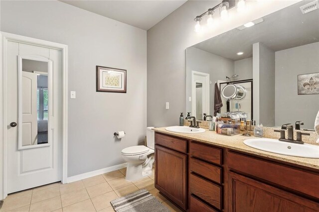 317 Haven Way, Lacombe, LA 70445 - bathroom with double vanity, tile patterned floors, toilet, baseboards, and a shower