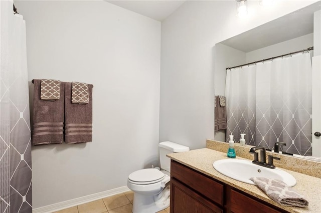317 Haven Way, Lacombe, LA 70445 - bathroom featuring vanity, toilet, tile patterned flooring, and baseboards