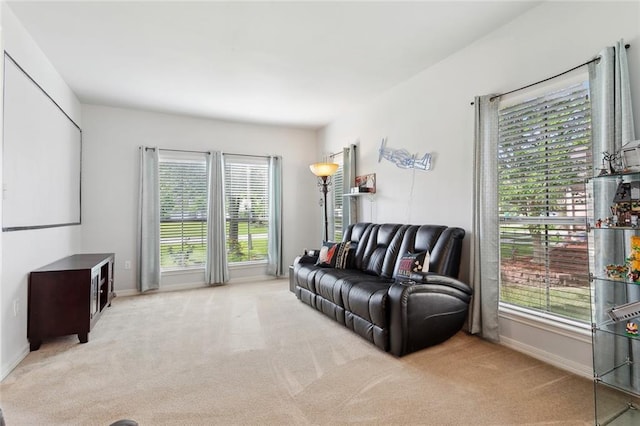 317 Haven Way, Lacombe, LA 70445 - living area featuring light carpet, plenty of natural light, and baseboards