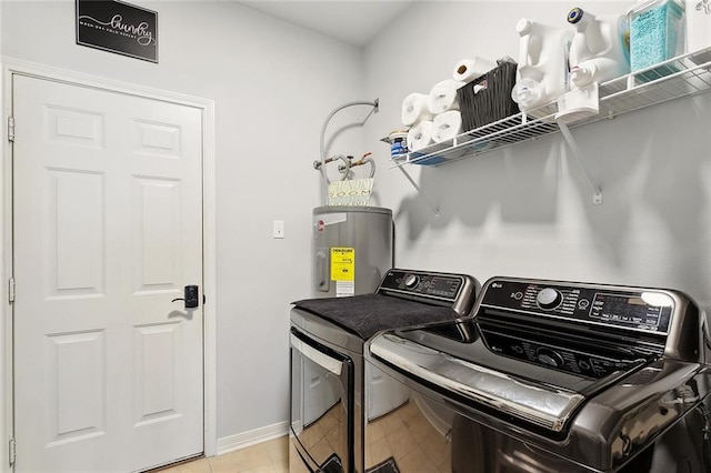 317 Haven Way, Lacombe, LA 70445 - laundry room with washer and clothes dryer, electric water heater, baseboards, and light tile patterned flooring