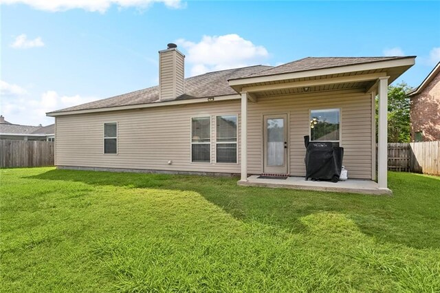 317 Haven Way, Lacombe, LA 70445 - rear view of house featuring a chimney, a patio area, and a shingled roof