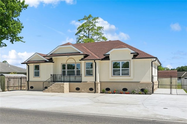 2925 Barataria Blvd, Marrero, LA 70072 - ranch-style house featuring stucco siding, concrete driveway, and a gate
