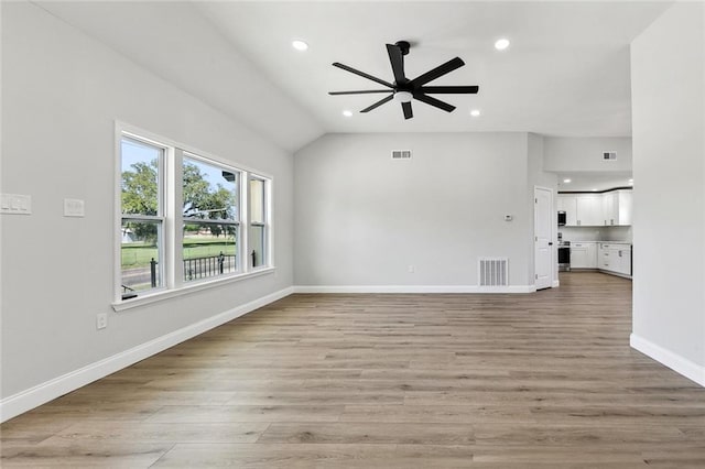 2925 Barataria Blvd, Marrero, LA 70072 - unfurnished living room with a ceiling fan, recessed lighting, light wood finished floors, baseboards, and vaulted ceiling