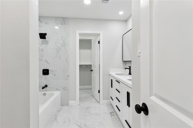2925 Barataria Blvd, Marrero, LA 70072 - full bathroom with marble look tiles, double vanity, recessed lighting, and shower / bathtub combination