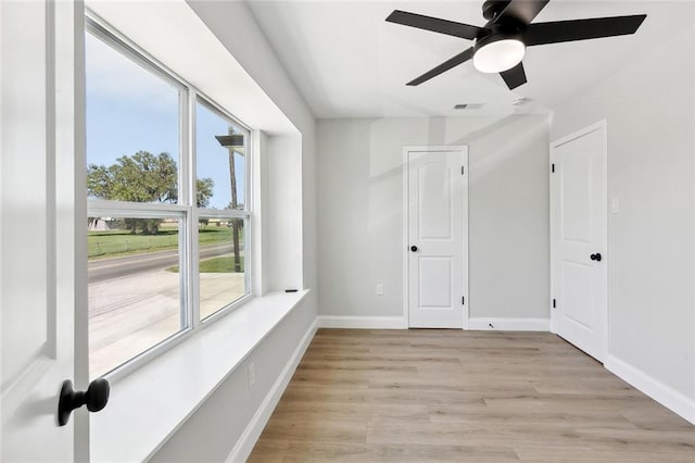 2925 Barataria Blvd, Marrero, LA 70072 - unfurnished room with light wood finished floors, a ceiling fan, and baseboards