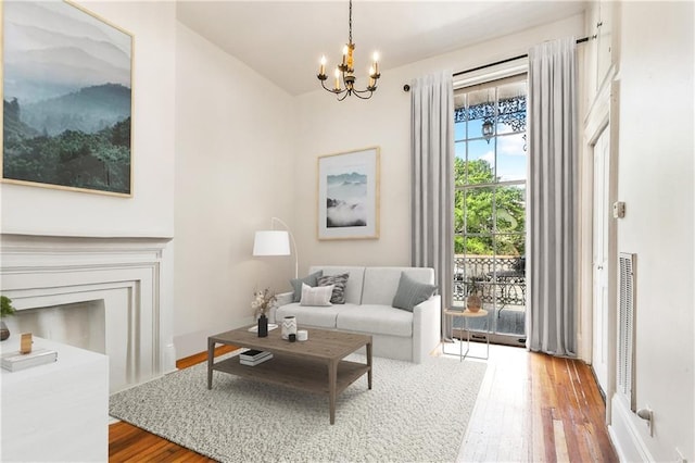 835 Saint Louis St Unit F, New Orleans, LA 70112 - living room with wood finished floors and a chandelier