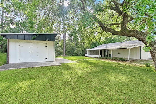 112 Oakwood Dr, Slidell, LA 70460 - view of grassy yard featuring a garage