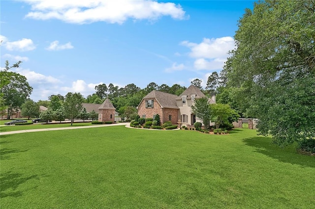 126 Tchefuncta Dr S, Covington, LA 70433 - view of front facade featuring a front lawn and brick siding