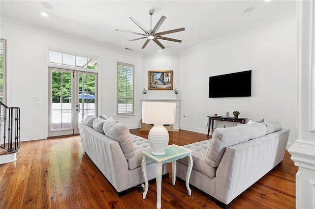 126 Tchefuncta Dr S, Covington, LA 70433 - living area with ceiling fan, baseboards, crown molding, wood finished floors, and stairway