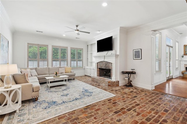 126 Tchefuncta Dr S, Covington, LA 70433 - living room featuring a brick fireplace, a ceiling fan, baseboards, recessed lighting, and crown molding