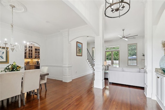 126 Tchefuncta Dr S, Covington, LA 70433 - entrance foyer featuring a chandelier, dark wood-style flooring, arched walkways, ornamental molding, and ceiling fan