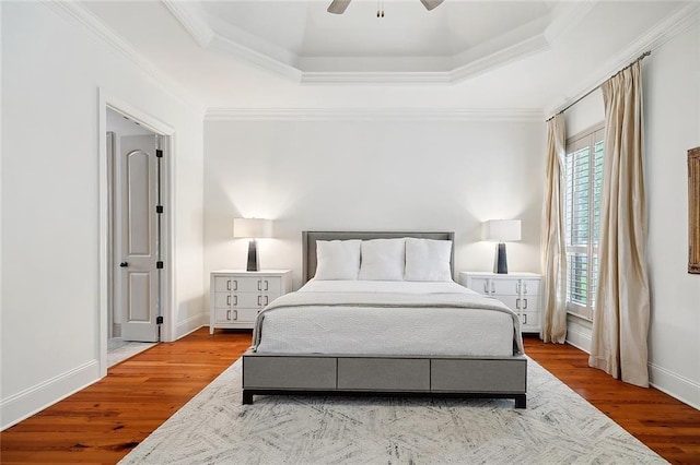 126 Tchefuncta Dr S, Covington, LA 70433 - bedroom featuring multiple windows, wood finished floors, baseboards, ornamental molding, and a raised ceiling