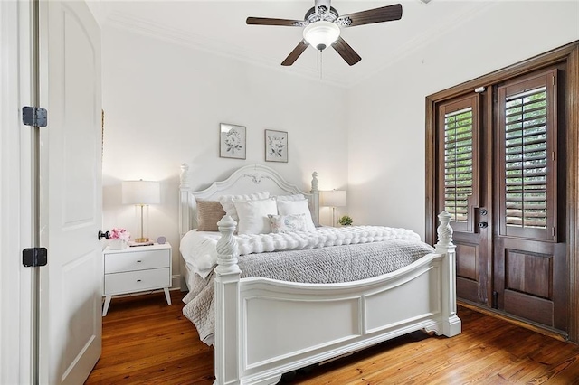 126 Tchefuncta Dr S, Covington, LA 70433 - bedroom with crown molding, wood finished floors, a ceiling fan, and baseboards