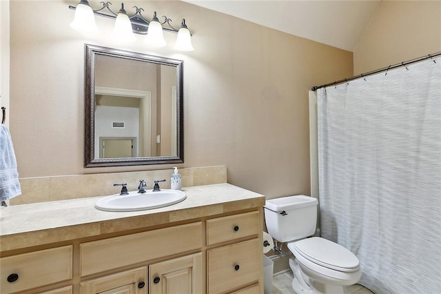 126 Tchefuncta Dr S, Covington, LA 70433 - full bathroom with vanity, toilet, lofted ceiling, and a shower with curtain