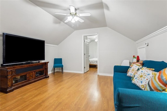 203 Willow Cir, Mandeville, LA 70471 - living room featuring a ceiling fan, light wood-type flooring, vaulted ceiling, and baseboards