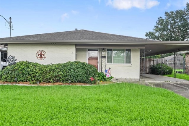 929 Carnation Ave, Metairie, LA 70001 - view of front of home with a carport, driveway, brick siding, and roof with shingles