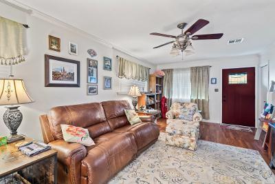 929 Carnation Ave, Metairie, LA 70001 - living area with a ceiling fan, wood finished floors, and crown molding