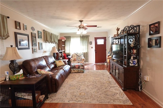 929 Carnation Ave, Metairie, LA 70001 - living room featuring a ceiling fan, wood finished floors, baseboards, and ornamental molding