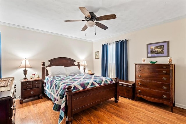 929 Carnation Ave, Metairie, LA 70001 - bedroom with crown molding, light wood-type flooring, and a ceiling fan