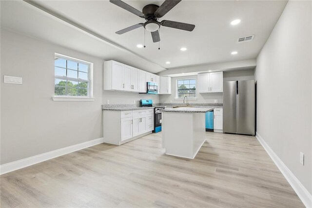 620 River Oaks Dr, New Orleans, LA 70131 - kitchen featuring stainless steel appliances, a sink, healthy amount of natural light, white cabinetry, and recessed lighting