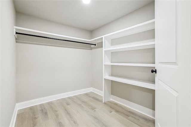 620 River Oaks Dr, New Orleans, LA 70131 - walk in closet featuring wood finished floors