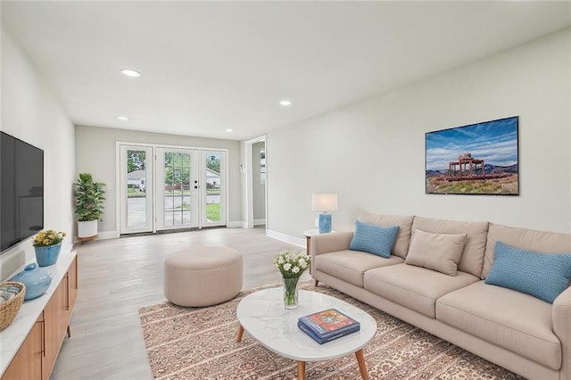 620 River Oaks Dr, New Orleans, LA 70131 - living room with light wood-style flooring, recessed lighting, and baseboards