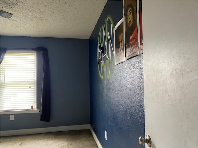 5425 Tulip Ct, Marrero, LA 70072 - spare room with baseboards, a textured ceiling, and carpet flooring
