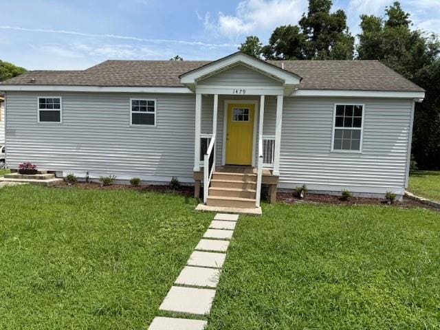 1479 Filmore Ave, New Orleans, LA 70122 - view of front of home featuring a front lawn and roof with shingles