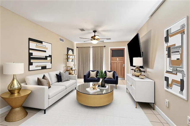 340709 Frenchmen St, New Orleans, LA 70122 - living room featuring light tile patterned floors, ceiling fan, and baseboards