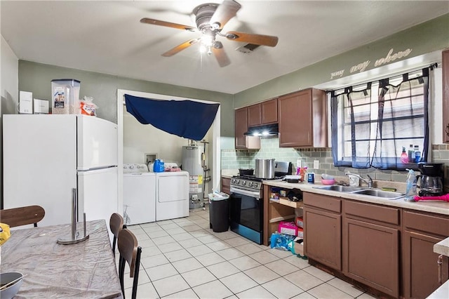 340709 Frenchmen St, New Orleans, LA 70122 - kitchen with separate washer and dryer, a sink, water heater, stainless steel range with gas cooktop, and under cabinet range hood