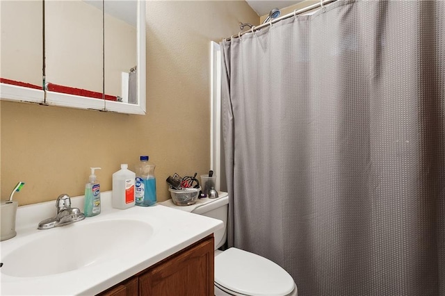 340709 Frenchmen St, New Orleans, LA 70122 - bathroom with toilet, vanity, and a shower with shower curtain