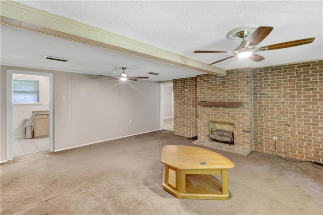 105 Norland Ave, New Orleans, LA 70131 - unfurnished living room with a ceiling fan, a textured ceiling, carpet, a brick fireplace, and brick wall