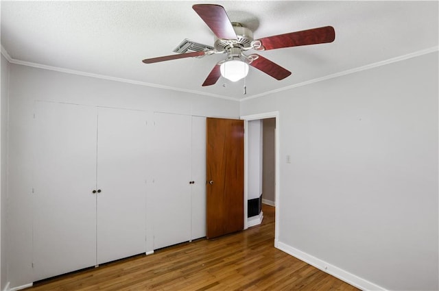 105 Norland Ave, New Orleans, LA 70131 - unfurnished bedroom featuring wood finished floors, ornamental molding, a closet, and ceiling fan