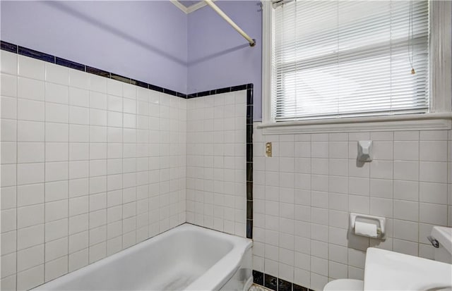 105 Norland Ave, New Orleans, LA 70131 - bathroom featuring tile walls and shower / washtub combination