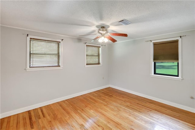 105 Norland Ave, New Orleans, LA 70131 - spare room with a ceiling fan, ornamental molding, light wood finished floors, and a textured ceiling