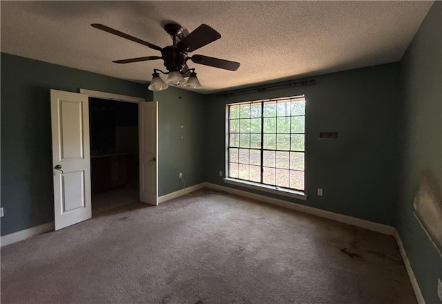 119 Devereux Dr, Slidell, LA 70461 - unfurnished bedroom with carpet floors, a textured ceiling, baseboards, and a ceiling fan