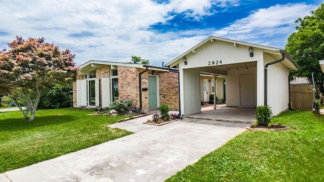 2924 Elizabeth St, Metairie, LA 70003 - view of front of property featuring driveway and brick siding